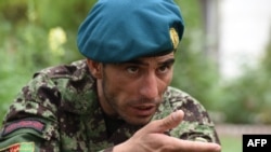 Afghan soldier Essa Khan Laghmani explains how he shot and killed six Taliban inside the Afghan Parliament in Kabul on June 24.