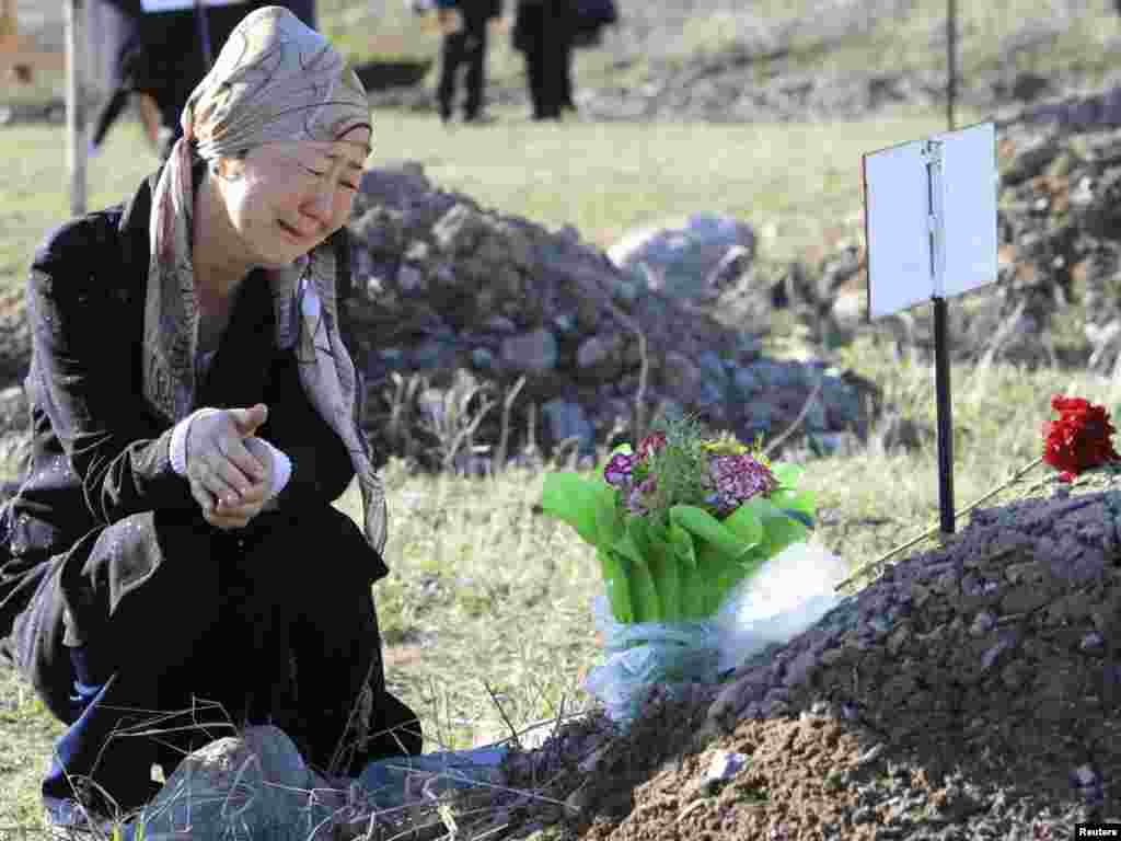 A Kyrygz woman mourns those who died in a &nbsp;violent revolt one year ago&nbsp;, during a remembrance ceremony held at a cemetery in the village of Chon-Aryk, about 15 kilometers from Bishkek on April 7. Photo by Vladimir Pirogov for Reuters