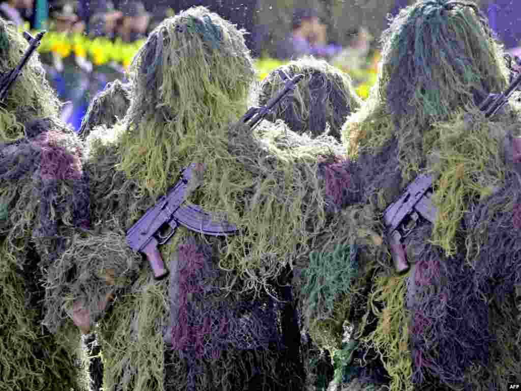 Iranian snipers in full camouflage take part in an Army Day parade in Tehran on April 18.