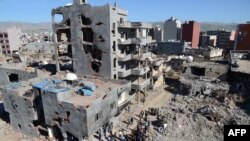Здания, разрушенные во время полицейской операции в Джизре