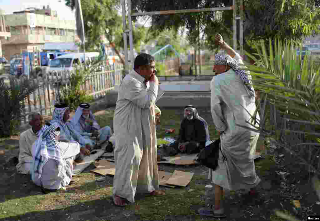 Men relax in Sadr City.