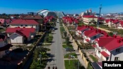 A birds-eye view shows the recently completed neighborhood of Nekrasovka bordering the Sochi 2014 Winter Olympic Park in Sochi.