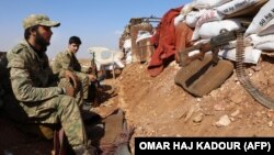 Syrian rebel-fighters from the National Liberation Front in Idlib Province