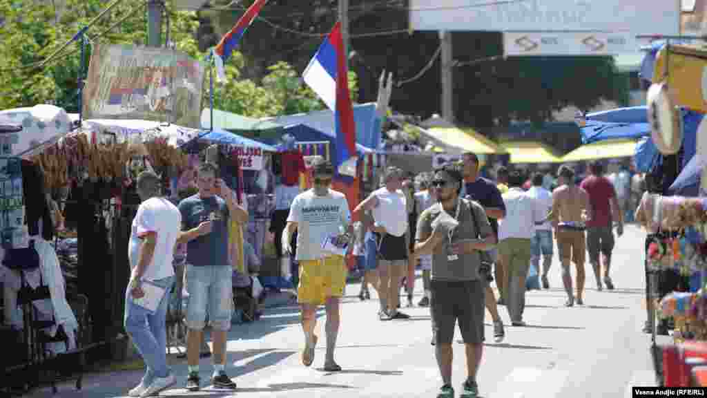 Traditional Serbian souveniars sold at the stalls in Guca. Serbian flags seen on the stands. Throughout the years the festival is getting commercialized.