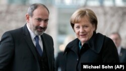 GERMANY -- German Chancellor Angela Merkel, right, welcomes Armenian Prime Minister Nikol Pashinian for a meeting at the chancellery in Berlin, February 1, 2019