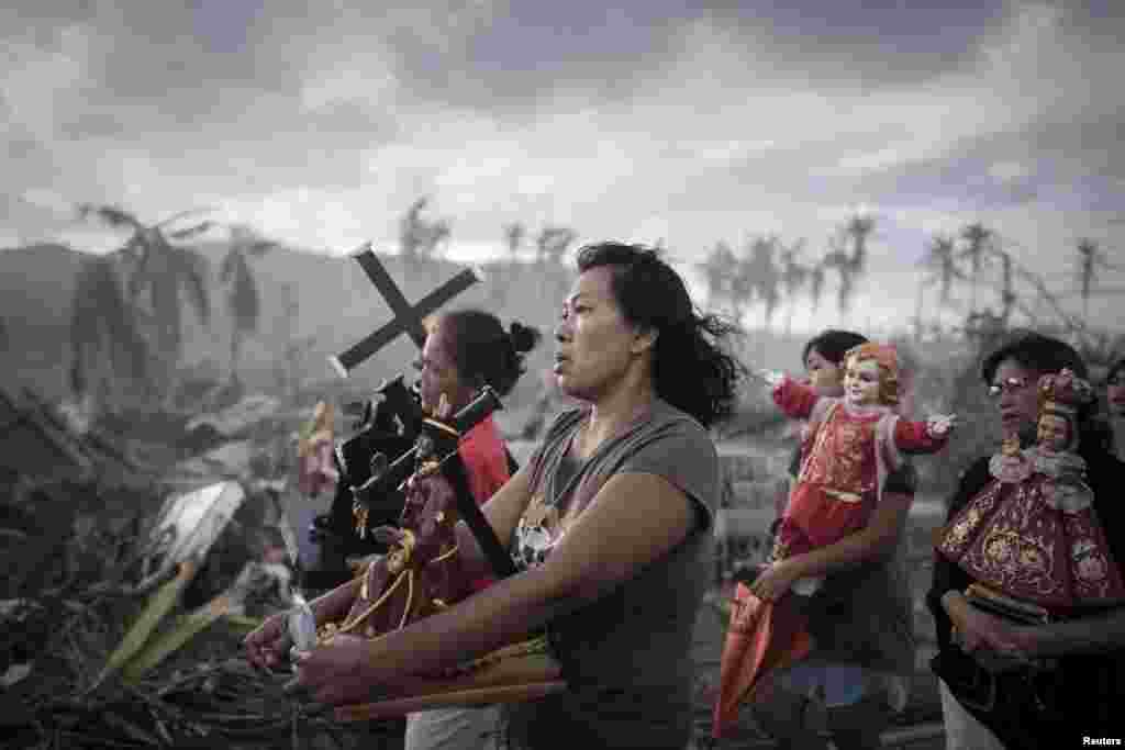 Phillipe Lopez, a French photographer working for Agence France-Presse, won first prize in the Spot News Single category with a picture of survivors of typhoon Haiyan marching during a religious procession in Tolosa, Philippines, on November 18, 2013.