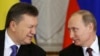 Russia's generous offer of cheaper gas and financial aid is seen by many as an attempt by President Vladimir Putin (right) to shore up his embattled Ukrainian counterpart Viktor Yanukovych (left) and keep Kyiv in the Kremlin's orbit.