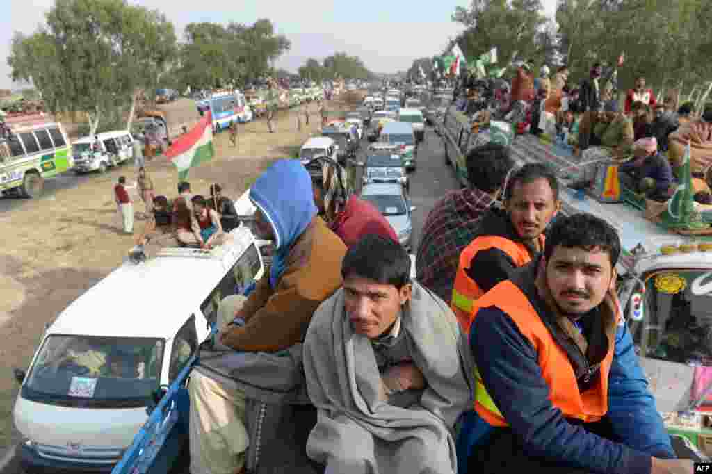 Participants ride through Sohawa, about 80 kilometers from Islamabad.