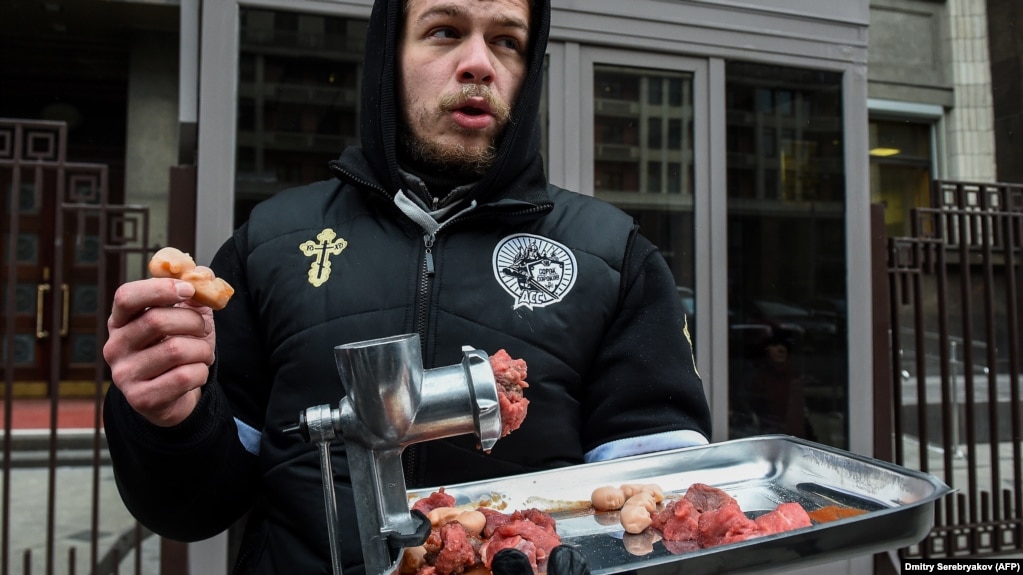 An activist of the ultra-conservative movement "Forty Forties" protests against abortion in front of the State Duma building in Moscow.