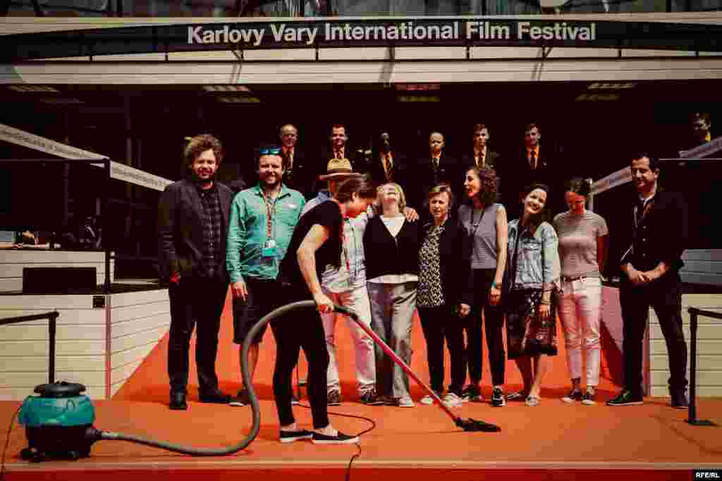 "Lights, Camera, Clean!" Director Vitaly Mansky and his wife Natalia Manskaya pose with the Current Time team at the July 2018 Karlovy Vary International Film Festival, Czech Republic.