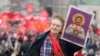 RUSSIA – Russian Communist party supporter carries a icon of Soviet dictator Joseph Stalin during the demonstration marking the Labor Day in Moscow, 01 May 2012