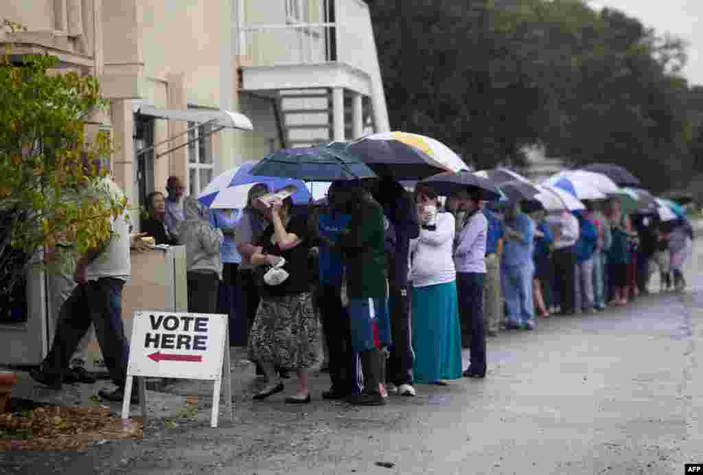 Voters wait in the rain in St. Petersburg, Florida.