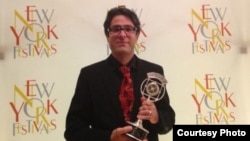 Radio Farda reporter Vahid Pourostad after receiving the New York Festivals' Silver Award, 17Jul2013.