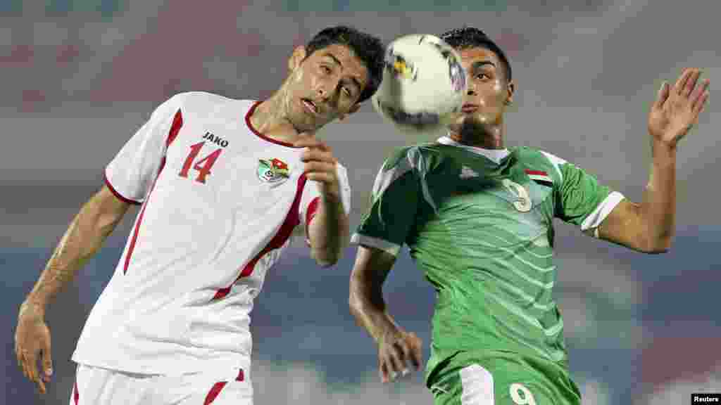 Iraq&#39;s Ahmed Gheni (right) challenges Jordan&#39;s Abdullah Salem during their West Asian Football Federation Championship soccer match in Kuwait City. (Reuters)