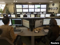 Technicians monitor data flow in the control room of an Internet service provider in Tehran. (file photo)