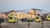 Погрузка тел погибших пассажиров самолета компании Metrojet в египетский военный вертолет. 31 октября