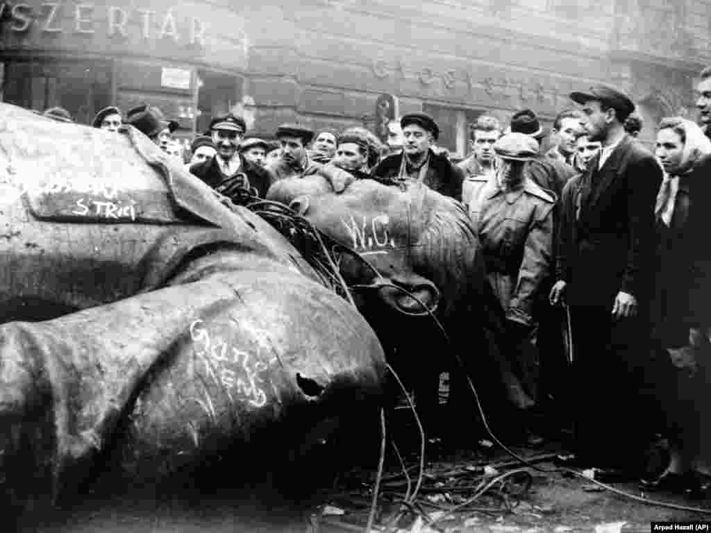 Hungarians surround a toppled statue of Josef Stalin amid the 1956 revolution.In 1956, RFE came under fire for broadcasts that many perceived as encouraging Hungary’s anti-communist uprising. The revolution was crushed by the Soviet military, killing thousands. In a look-back on RFE’s 1956 broadcasts to Hungary, which included some technical advice on keeping revolutionary momentum rolling, one former RFE director concluded “it is never [the radio’s] function to tell people what they should do -- and least of all under conditions of violent upheaval.”
