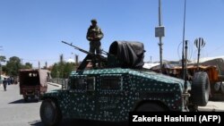 Afghan security forces patrol along a road in the city of Ghazni, August 14, 2018. File photo