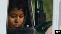 Rimsha Masih, a disabled Pakistani Christian girl accused of insulting Islam sits in a helicopter after her release from jail in Rawalpindi. She had been held on blasphemy charges for over a month until domestic and international condemnation prompted her release.