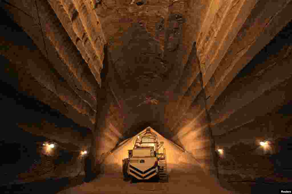 A miner operates machinery in a potassium mine.