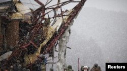 Heavy snowfall in the worst-affected areas -- in northeastern Japan -- is complicating rescue and relief efforts for some 500,000 people made homeless.