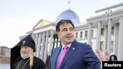 Karekin II (left), the head of the Armenian Apostolic Church, walks with Georgian President Mikheil Saakashvili (center) and Georgian Orthodox Church Patriarch Ilia II in Tbilisi in June. 