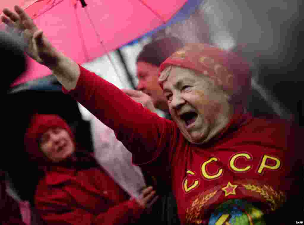 A woman with a U.S.S.R. sign written on her T-shirt takes part in a march organized by the Russian Communist Party in Moscow. (ITAR-TASS/Sergei Bobylev)