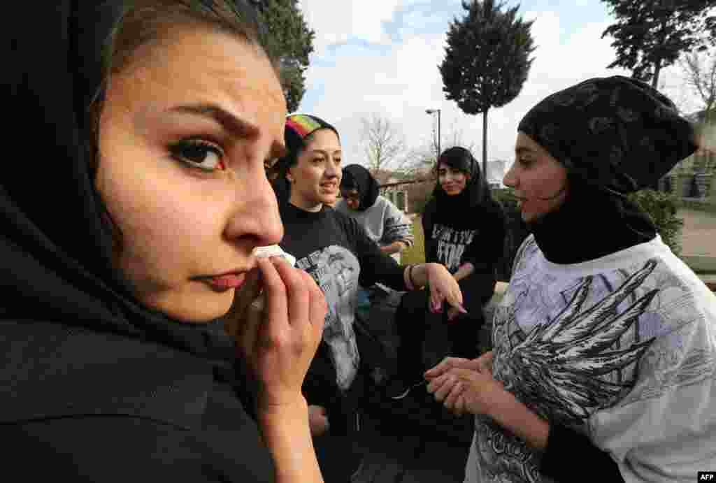 Iranian women during a break from parkour practice in Tehran's Tavalod Park.