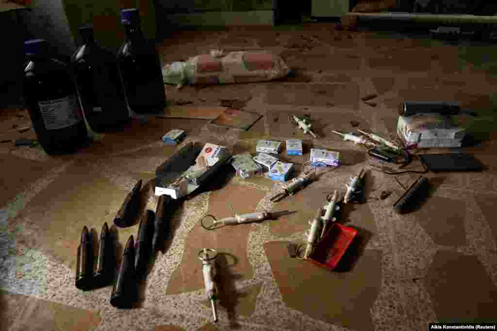 Materials for bomb making on the floor of the compound. The extremist group is known for leaving behind booby traps as they retreat. 