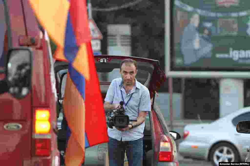 Armenia -- RFE/RL journalist at work in Yerevan, undated. RFE/RL journalists were among those beaten and detained while covering demonstrations in the capital in June 2015. 