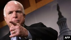 U.S. Senator John McCain is among those who are unhappy with the new U.S. spending bill, which he says panders to "[Russian President] Vladimir Putin and his gang of thugs." (file photo)