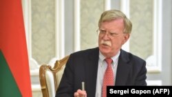 BELARUS -- U.S. National Security Advisor John Bolton speaks with Belarusian President Alyaksandr Lukashenka during their meeting in Minsk, August 29, 2019