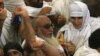 Saudi Arabia -- Muslim pilgrims throw pebbles at pillars during the "Jamarat" ritual, the stoning of Satan, in Mina near the holy city of Mecca, 27Nov2009