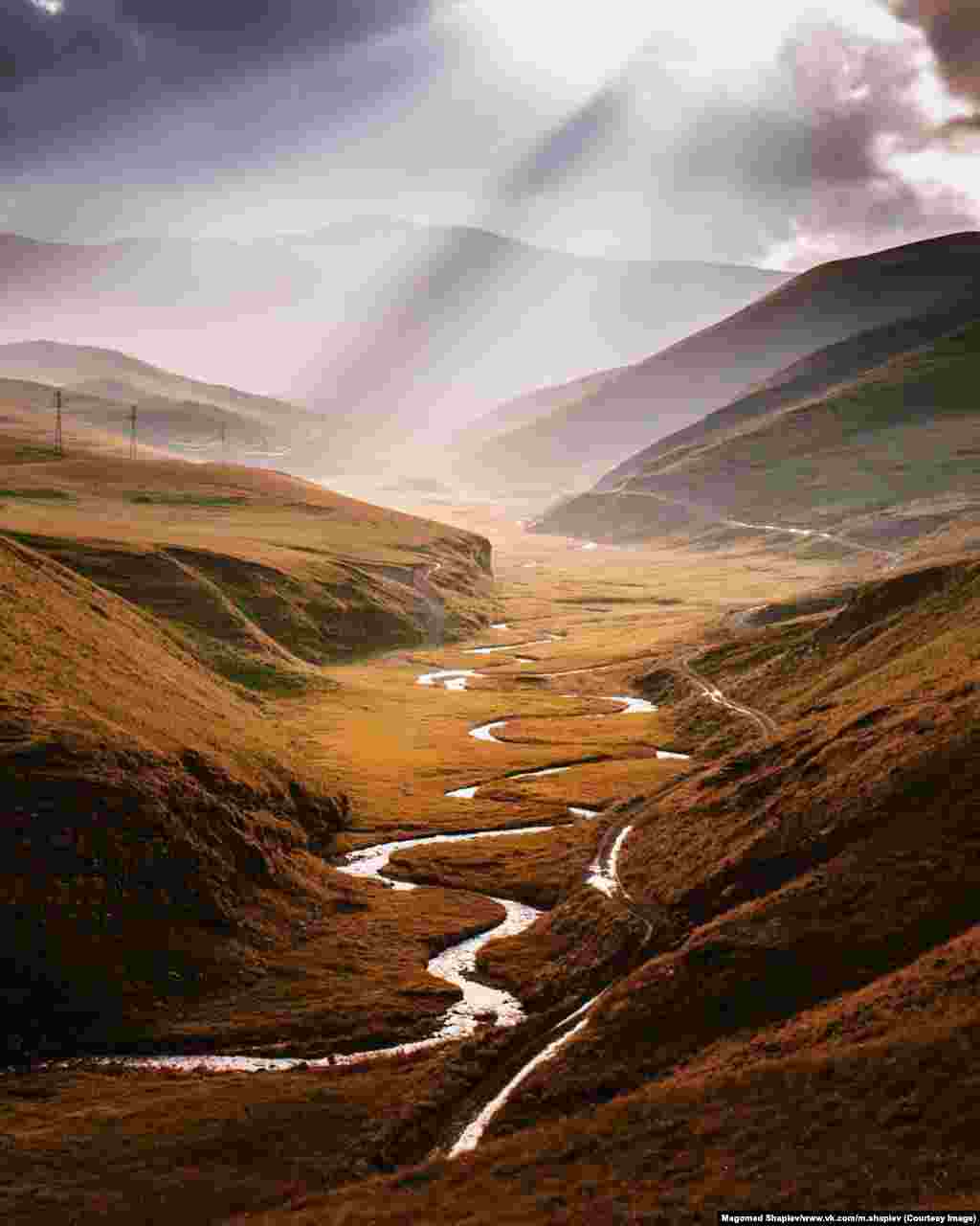 The Chirag-Chai River under a break in the clouds. Shapiev says he now does &quot;various jobs,&quot; including freelance photography to stay afloat. He hopes to make a career out of photographs like this one and recently landed his first assignment from the Russian edition of National Geographic.&nbsp;