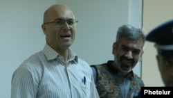 Armenia - Varuzhan Avetisian (L), the leader an armed opposition group that seized a police station in July 2016, at the start of his trial in Yerevan, 8Jun2017.