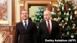 Președintele Vladimir Putin și premierul Dmitri Medvedev la Kremlin, 25 decembrie 2019