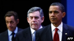 U.S. President Barack Obama (right), British Prime Minister Gordon Brown (center), and French President Nicolas Sarkozy gather to condemn Iran after Tehran revealed it is secretly building a second uranium-enrichment facility.