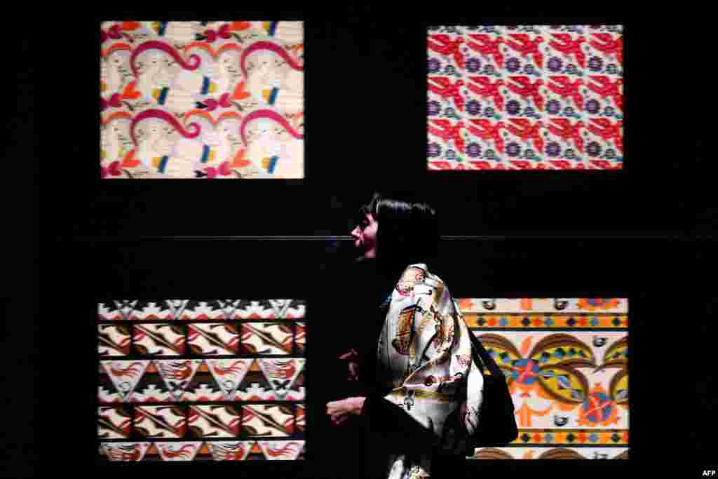 A visitor examines a display at an exhibition dedicated to the 150th anniversary of Russian theatrical designer Leon Bakst's birth at the Pushkin Museum of Fine Arts in Moscow. (AFP/Kirill Kudryavtsev)