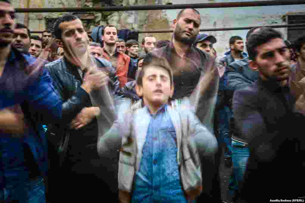A young Shi'ite worshiper in Baku. The festival of Ashura honors the death of Imam Hussein, grandson of the Prophet Muhammad. He was killed in the year 680, and his death laid the foundations of the Shi'ite faith.
