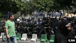 Security guards on the streets around the Iranian parliament in Tehran on June 7.