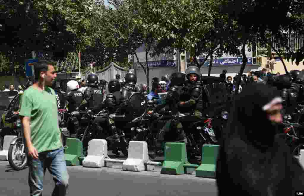 Security forces gather on the streets around the parliament.