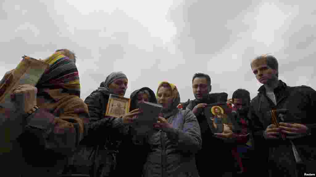 Orthodox believers gather outside the court building during the hearing. The Pussy Riot members were convicted of "hooliganism motivated by religious hatred" for their performance in Moscow's Orthodox cathedral.