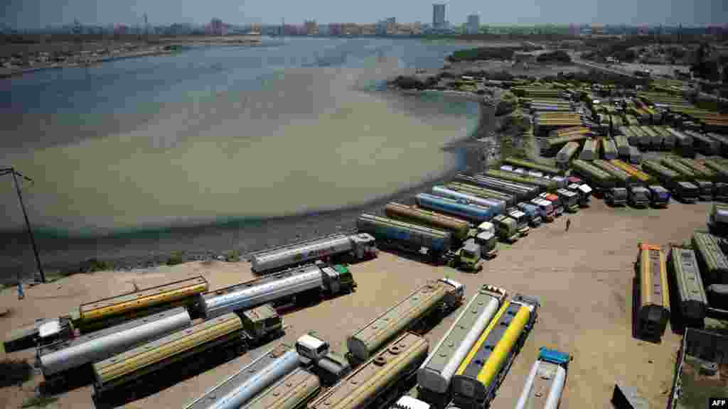 Tanker trucks parked near oil terminals in Karachi on May 15.