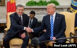Uzbek President Shavkat Mirziyoev (left) with his U.S. counterpart Donald Trump in Washington on May 16.
