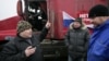 Dozens of long-distance truckers set up protest camps on the outskirts of Moscow to protest a new Kremlin-sanctioned road-levy, which they say amounts to highway robbery. 