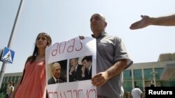 Journalists protest outside the Interior Ministry office in Tbilisi on July 7 following the arrests.