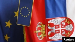 European Union flags are seen together with the Serbian flag in a shop in Belgrade.