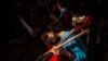 A member of Afghanistan&#39;s first all-female orchestra rests during the soundcheck before performing in downtown Bratislava. (AFP/Vladimir Simicek)&nbsp;