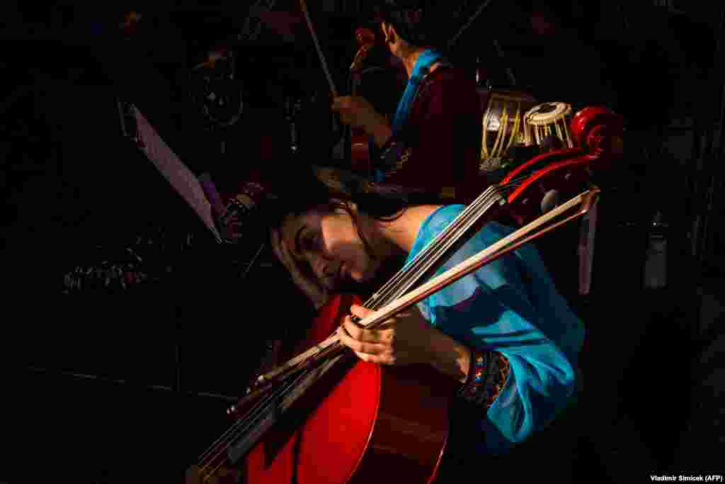 A member of Afghanistan&#39;s first all-female orchestra rests during the soundcheck before performing in downtown Bratislava. (AFP/Vladimir Simicek)&nbsp;