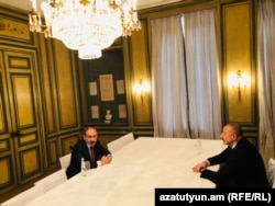 Armenian Prime Minister Nikol Pashinian (left) and Azerbaijani President Ilham Aliyev during a meeting in Munich, Germany, in February. (file photo)